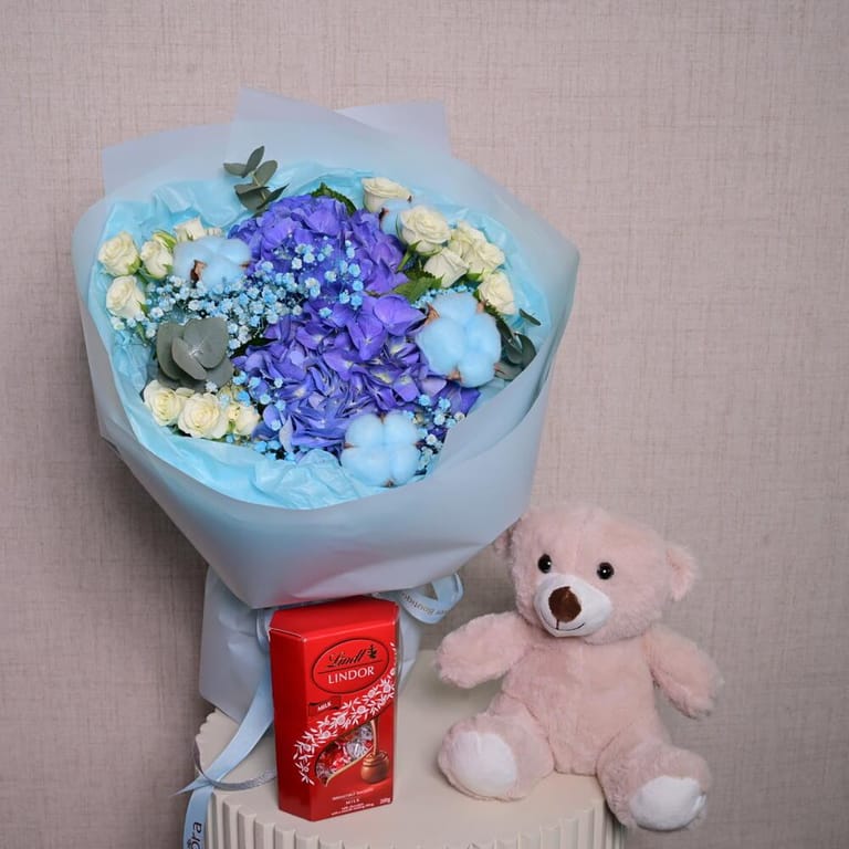 Blue Flowers Teddy Bear And Lindt Chocolates Gift Combo-C84 - Image 1