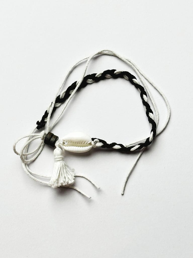 White-black threaded cowrie shell wristband - Image 1
