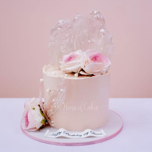 Decadent pink cake with roses
