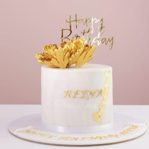 Decadent cake with gold flower