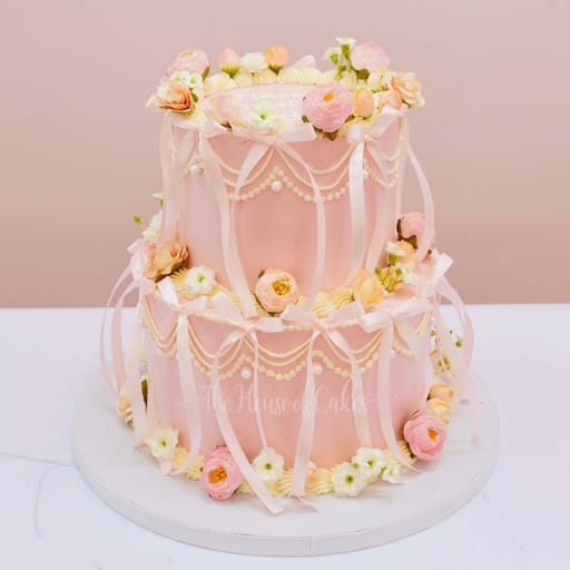 Exquisite pink cake with ribbons