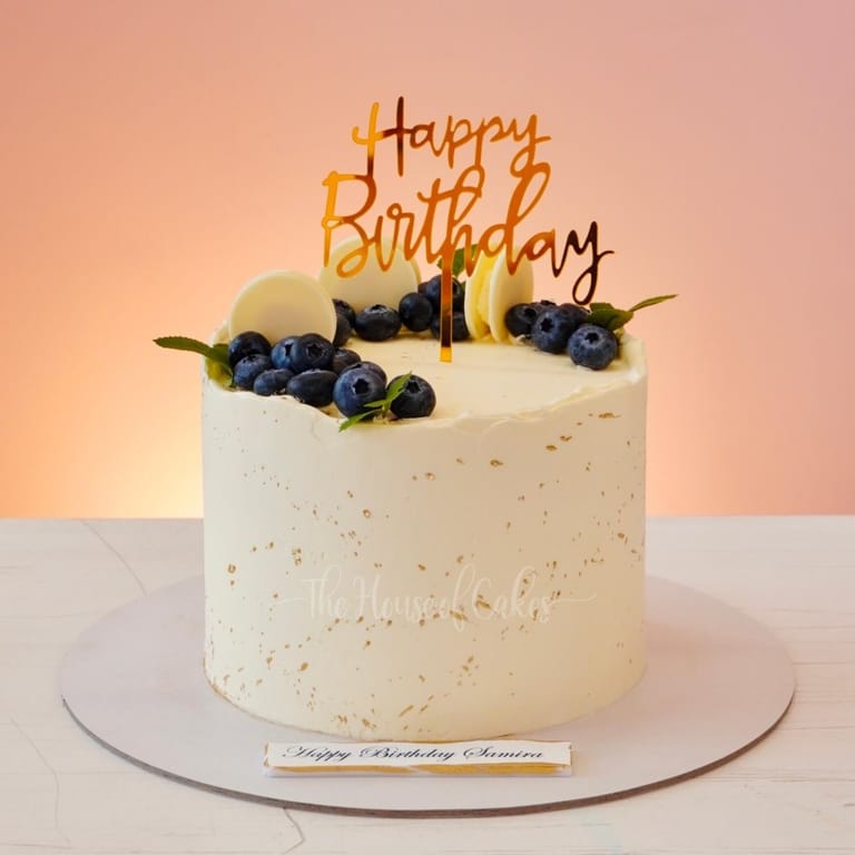 Elegant birthday cake with blueberries - Image 1