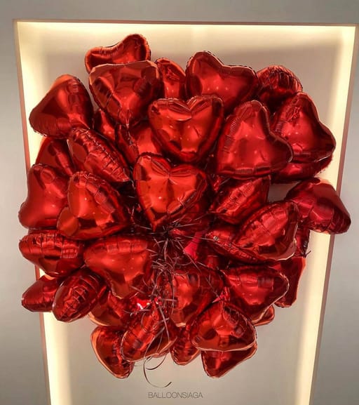 Bunch of red heart shaped balloons