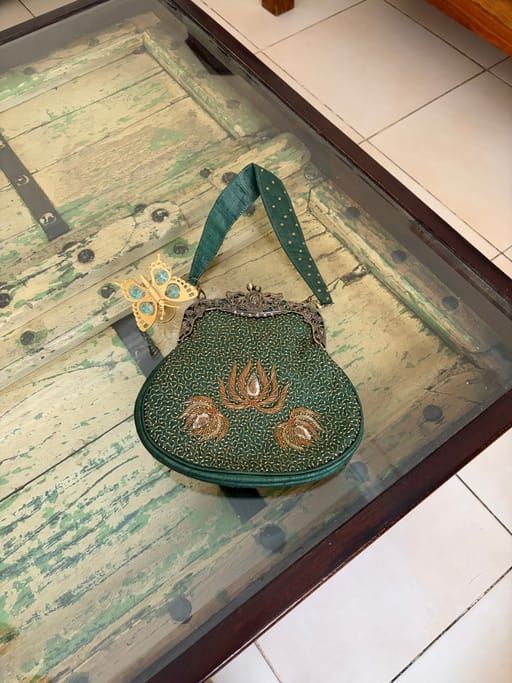 Green raw silk bag with zardozi work