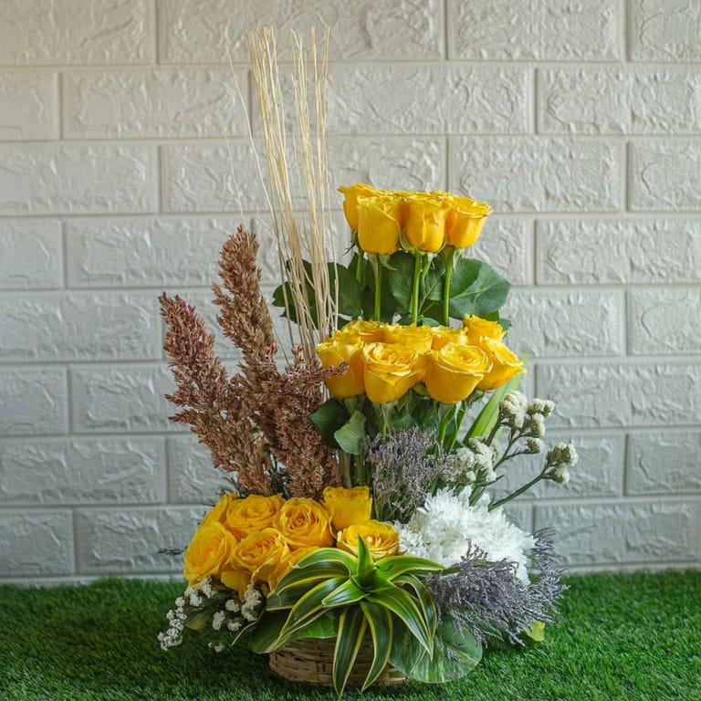 Yellow roses , dry sticks chrysanthemum in a basket - Image 1