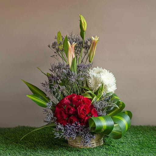Arrangements of red roses, chrysanthemum , lilies an limonium