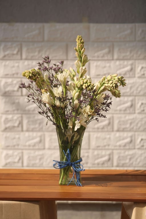 Vase of tube rose and limonium