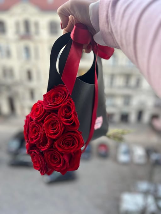 11 red roses in the bag